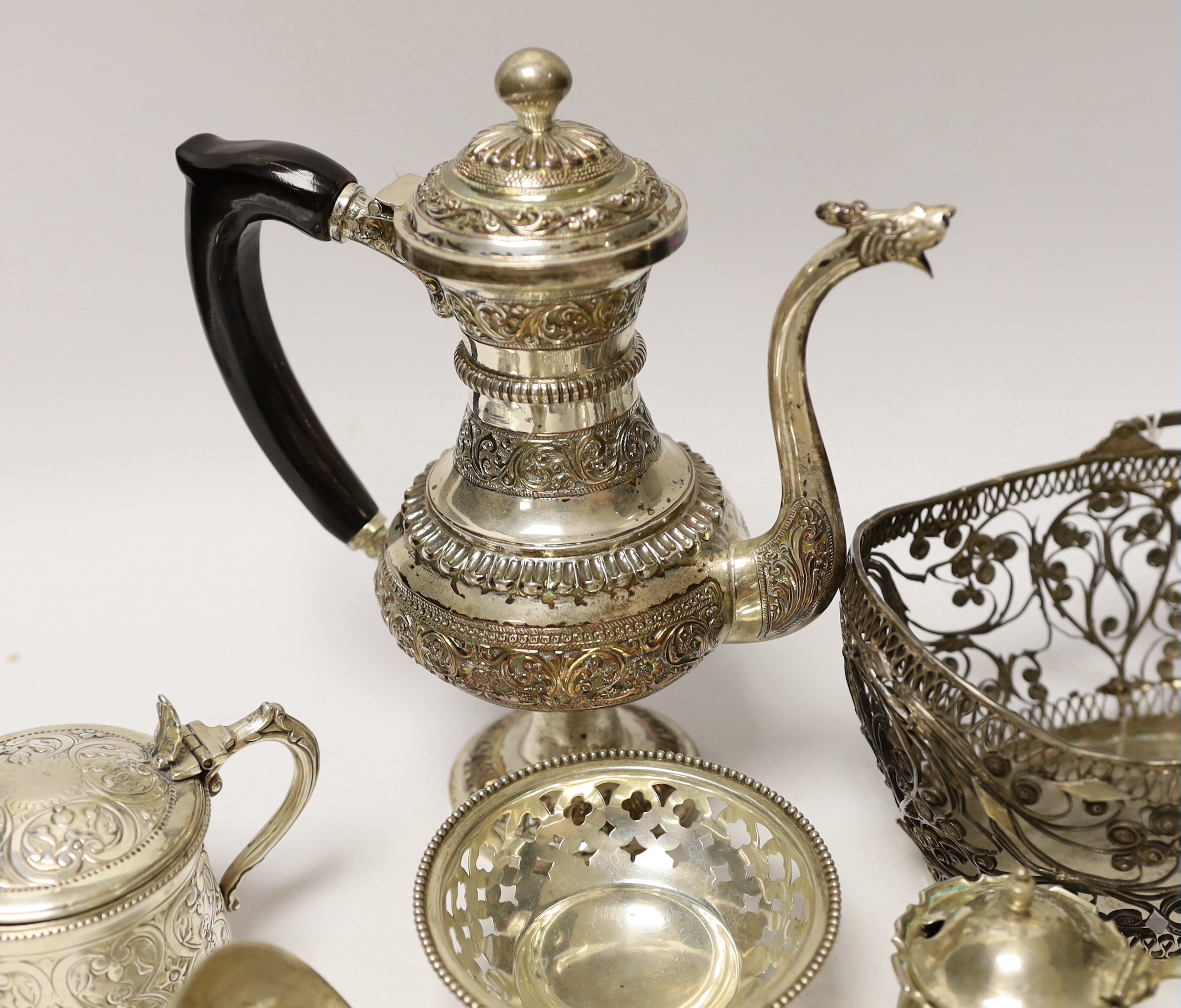 A quantity of silver and white metal items including a continental filigree basket, small silver bonbon dish, George III soup ladle, salts, Victorian silver mustard, etc.